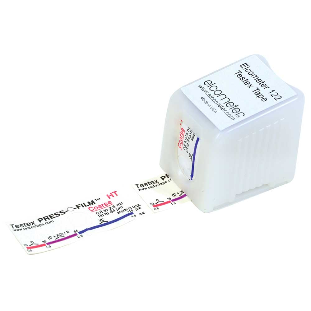 A square case lay flat with a sticker on the top readying 'Elcometer 122 Testex Tape' and below that reads 'elcometer www.elcometer.com'. The measuring tape is being pulled from underneath and there are measurements along the bottom of the tape with the colours pink, purple and blue