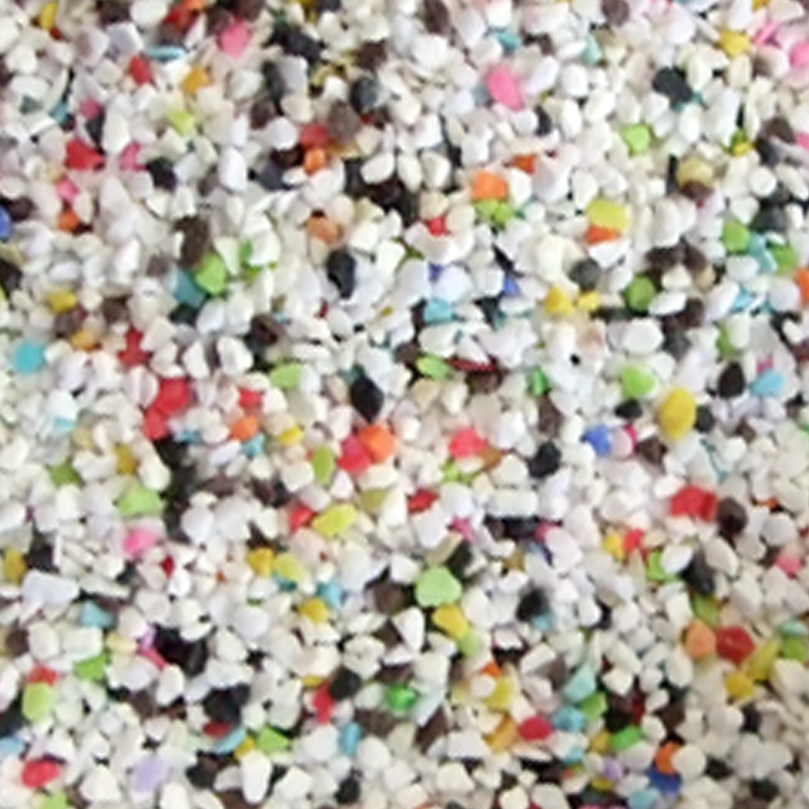 Small circular stones or pebbles. The majority of them are white but there is also a mix of black, red, pink, blue, green, yellow and orange.